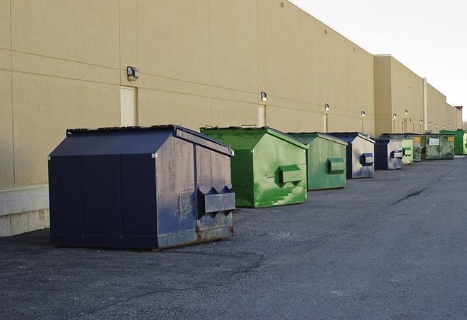 several large trash cans setup for proper construction site cleanup in San Fernando